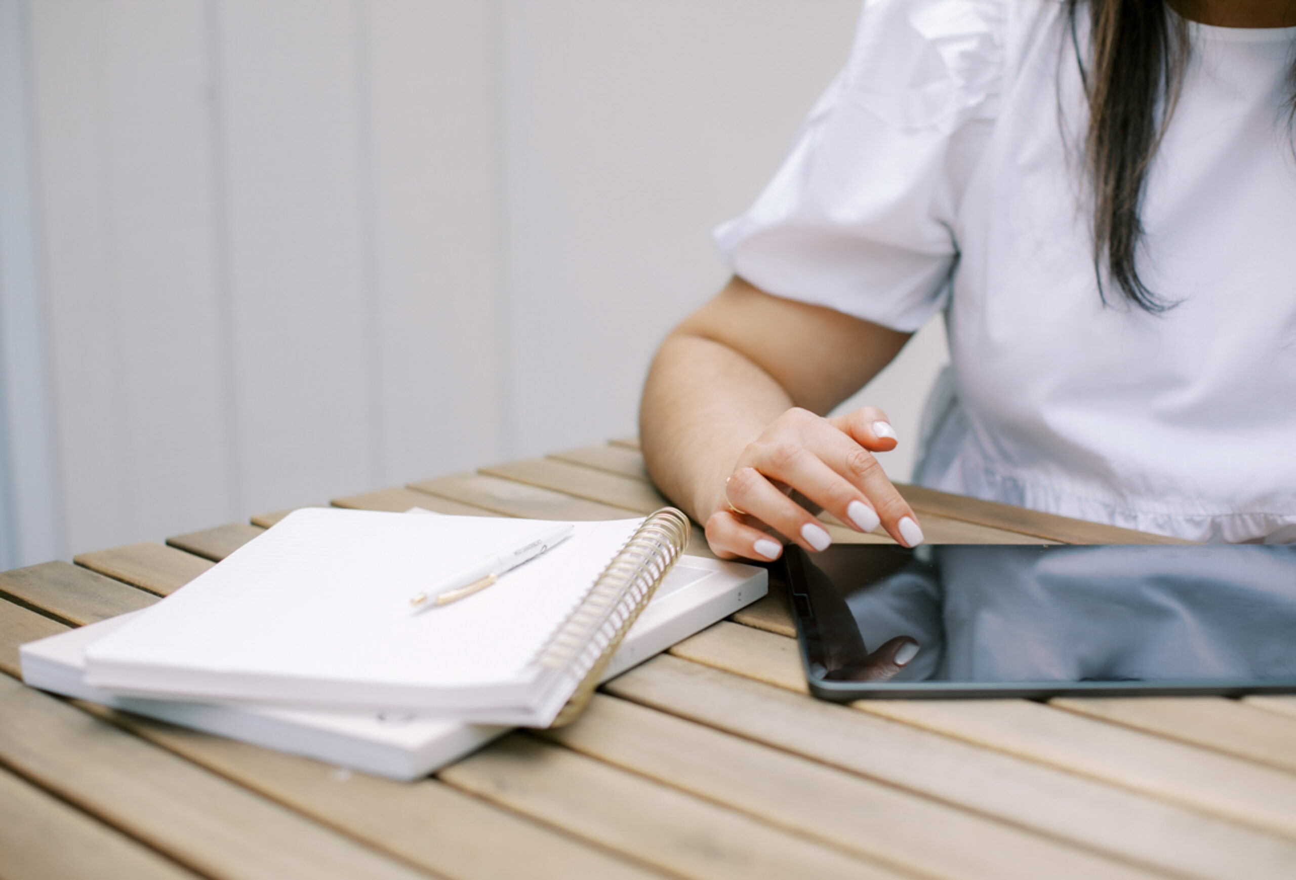 woman scrolling on a tablet