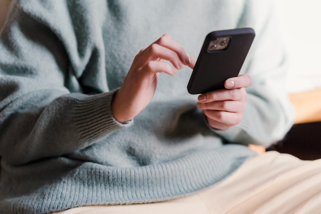 a person scrolling on using a phone