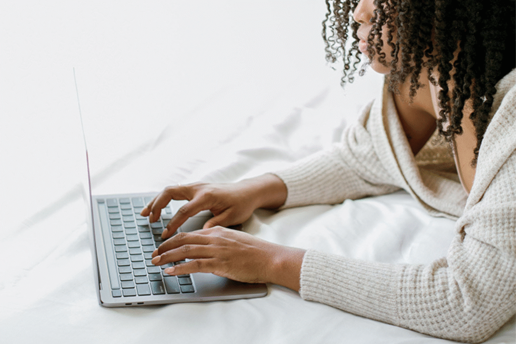 woman typing on a laptop