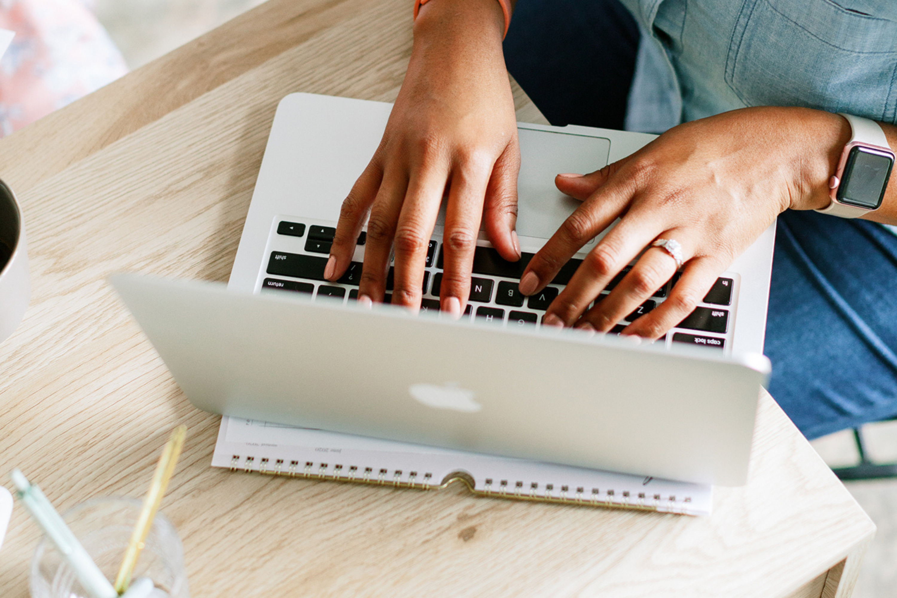woman typing on the laptop organizing a blog