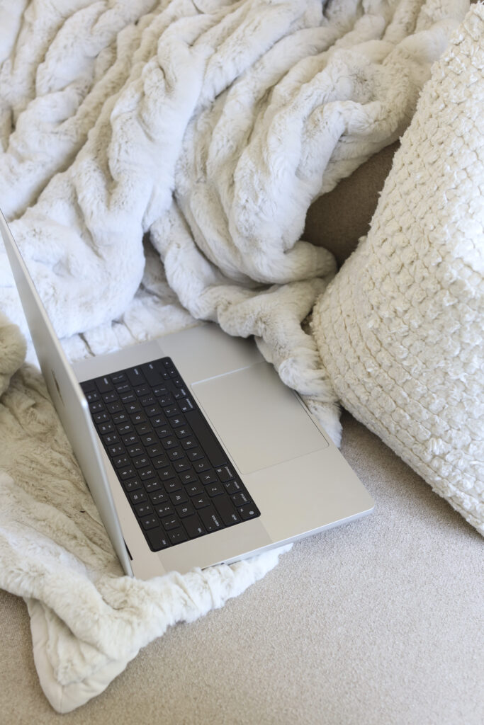 a laptop resting on a couch