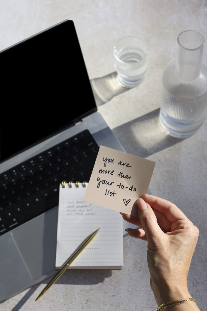 a hand holding a note - 3 things to cut for overwhelmed new bloggers