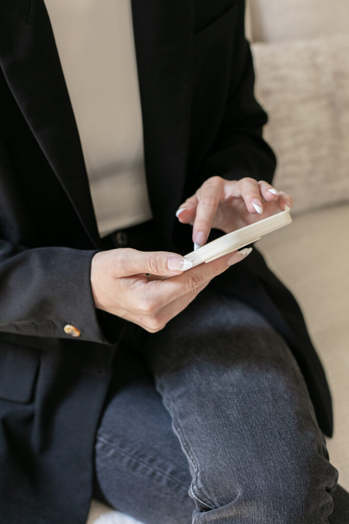 woman scrolling through her phone