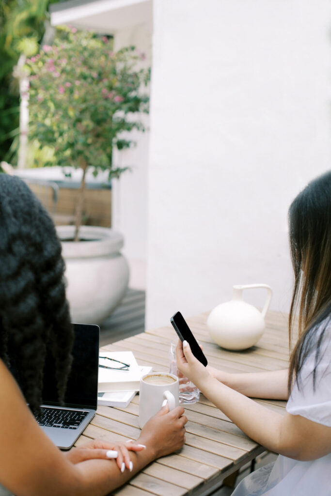 ladies using a laptop and a mobile phone