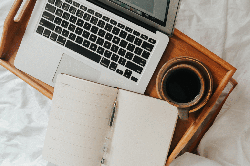 laptop with coffee and notes