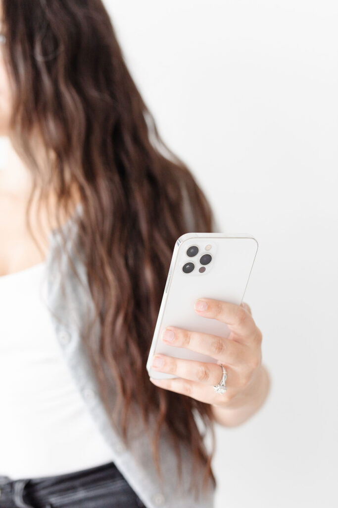 a woman holding her phone